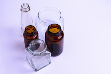 Empty glass bottles of various sizes.