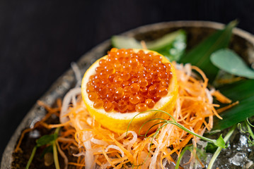 red caviar on lemon © Maksim Shebeko