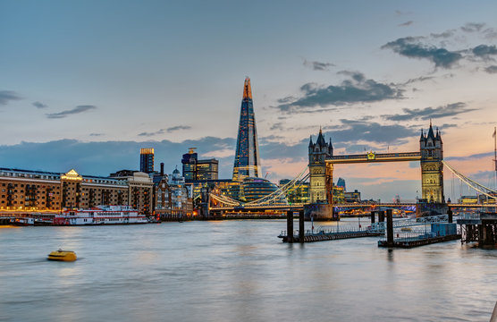 The skyline of London with the Tower Bridge and the Shard after sunset