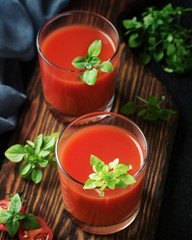 Tomato juice on a wooden board