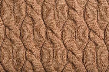 Knitted Wool Background. The knitted fabric texture. autumn -winter braid pattern