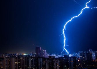 Lightning strike in the city Kyiv.. Storm outside. Thunderstorm with lightning in the city. Moment...