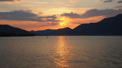 Iseo, Brescia, Italy. Amazing warm sunset at Iseo lake