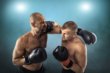 Fototapeta na wymiar Two professional boxers, athletes in dynamic boxing action 