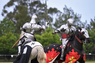 Two medieval knights confront during jousting tournament