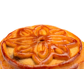 side view studio shoot of traditional Chinese mooncake on white close up with copy space