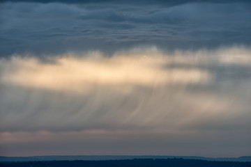 Beautiful Summer sunset sky with colorful vibrant cloud formations