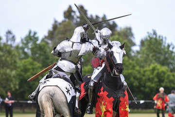 Two medieval knights confront during jousting tournament