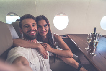 Couple on vacation, flying on their private jet