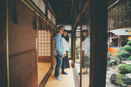 Young japanese couple spending time in their house