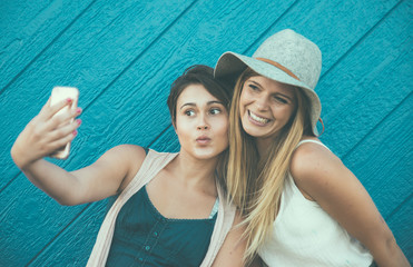 Friends having fun against blue background