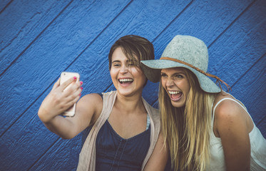 Friends having fun against blue background