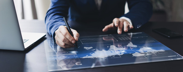 Man working on progect using high technology tablet
