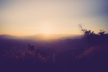 Scenic view of sunrise mountains at northeast Thailand, Mountain range for climbing in mountain trails. the landscape of mountain which including of copy-space for texting. 