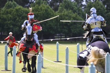 Two medieval knights confront during jousting tournament