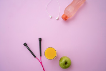 Fitness equipment. Healthy food. Sport shoes with water on background