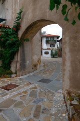 City gates leading into the Main Square in Historic medieval town of Smartno in Goriska Brda,...