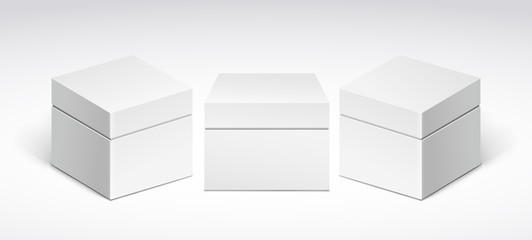 Three white packing boxes with lid, front view and side view.