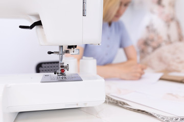 Close-up of sewing machine in the seamstress office