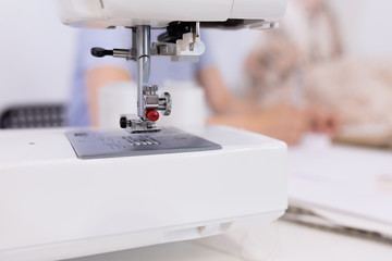 Close-up of sewing machine in the seamstress office