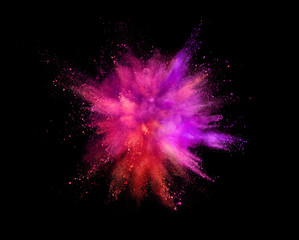 Coloured powder explosion isolated on black background