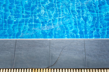 Swimming pool with stair at hotel. Foam board for the teaching of swimming beside swimming pool. - Vintage Tone.
