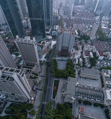 Aerial View of business area and cityscape in foggy dawn, West Nanjing road, Jing`an district, Shanghai