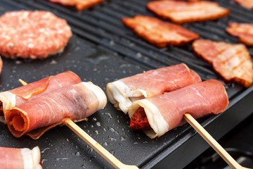 Meat on an electric grill. Home cooking. Healthy barbecue. Catering to friends. Electric grilling.