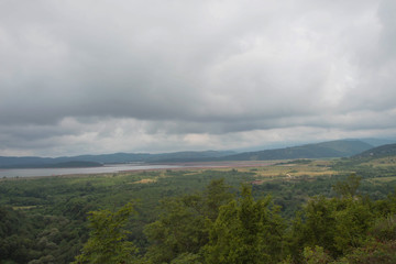 Mountains, forest and lake in the valley. Beautiful natural vacation