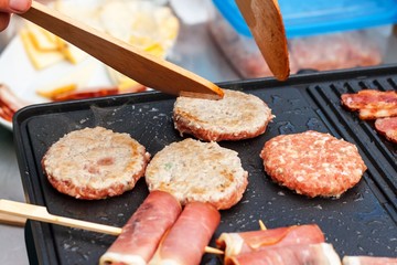 Meat on an electric grill. Home cooking. Healthy barbecue. Catering to friends. Electric grilling.