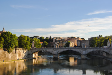 Fototapeta premium The view of Ponte Vittorio Emanuele - the bridge across the Tiber river near Vatican City, shot during the golden hour. 