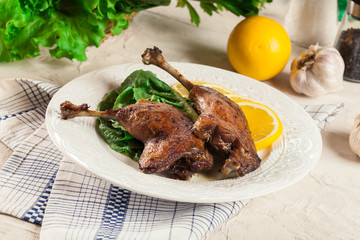 Duck legs confit with orange and salad