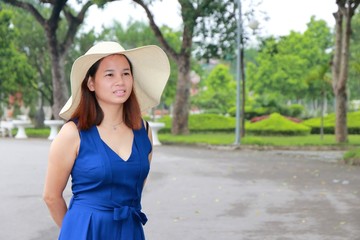 a woman with hat in summer