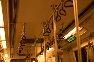 inside delhi metro interior handles at night