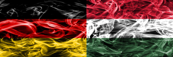 Germany vs Hungary smoke flags placed side by side. German and Hungary flag together