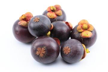Fresh mangosteens on white background, isolated. Mangosteen, queen of fruits. Tropical fresh fruit.