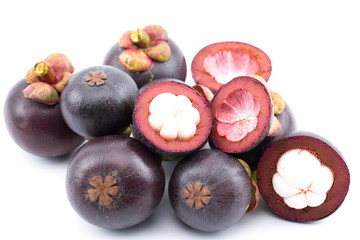 Fresh mangosteens on white background, isolated. Mangosteen, queen of fruits. Tropical fresh fruit.