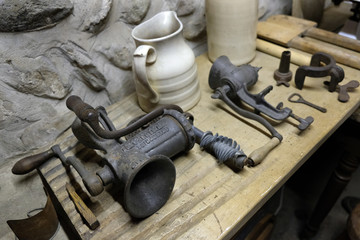 Vintage kitchen equipment including hand mincer.