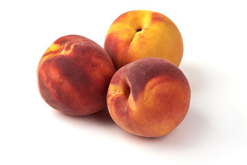 Fototapeta na wymiar Fresh ripe peaches, isolated on white background.