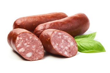 Smoked sausages with basil herb, isolated on white background.