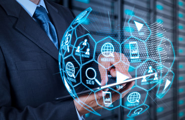 businessman  using tablet computer and server room background