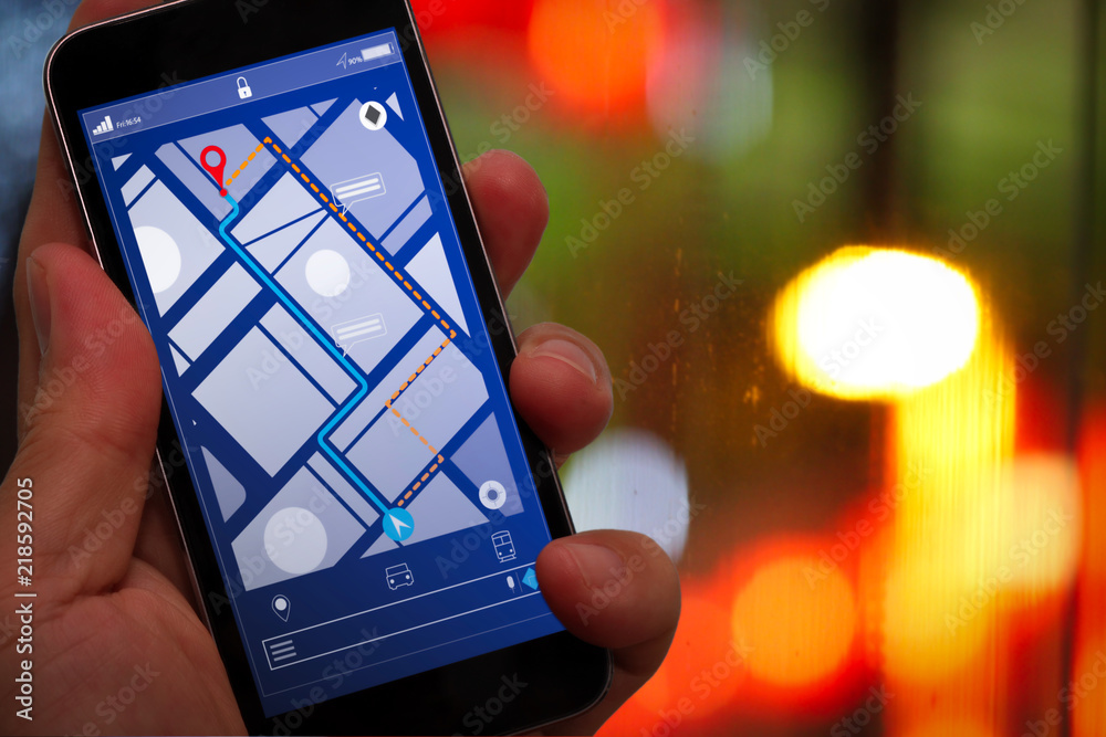 Poster Close up of Tourist using GPS map navigation on smartphone application screen for direction to destination address in the city with travel and technology concept.