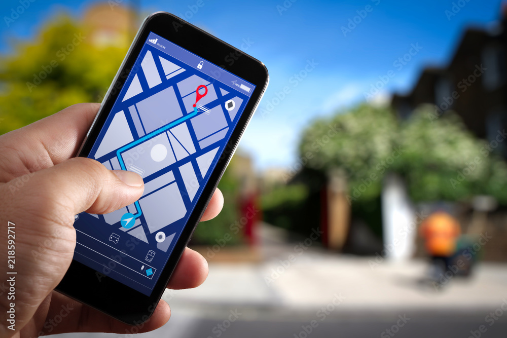 Aufkleber Close up of Tourist using GPS map navigation on smartphone application screen for direction to destination address in the city with travel and technology concept.