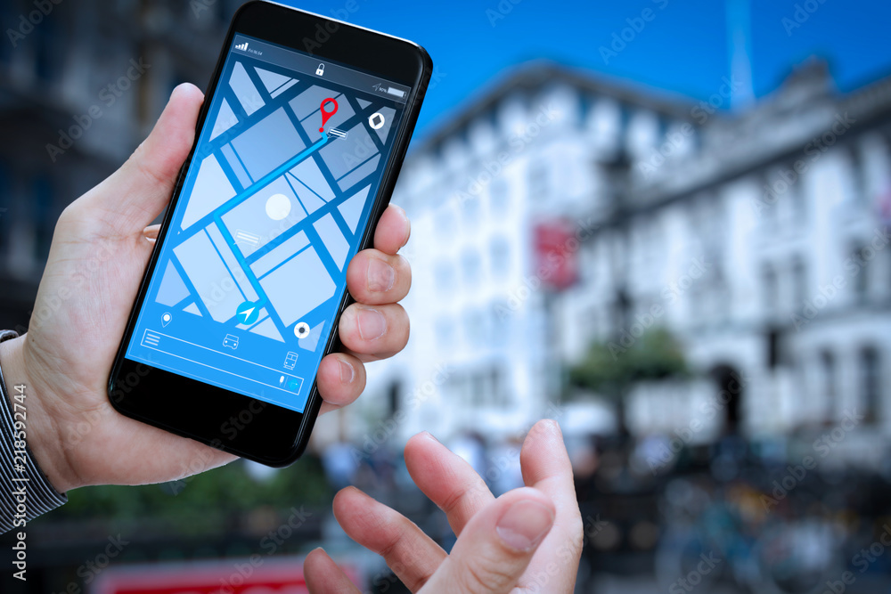 Aufkleber Close up of Tourist using GPS map navigation on smartphone application screen for direction to destination address in the city with travel and technology concept.