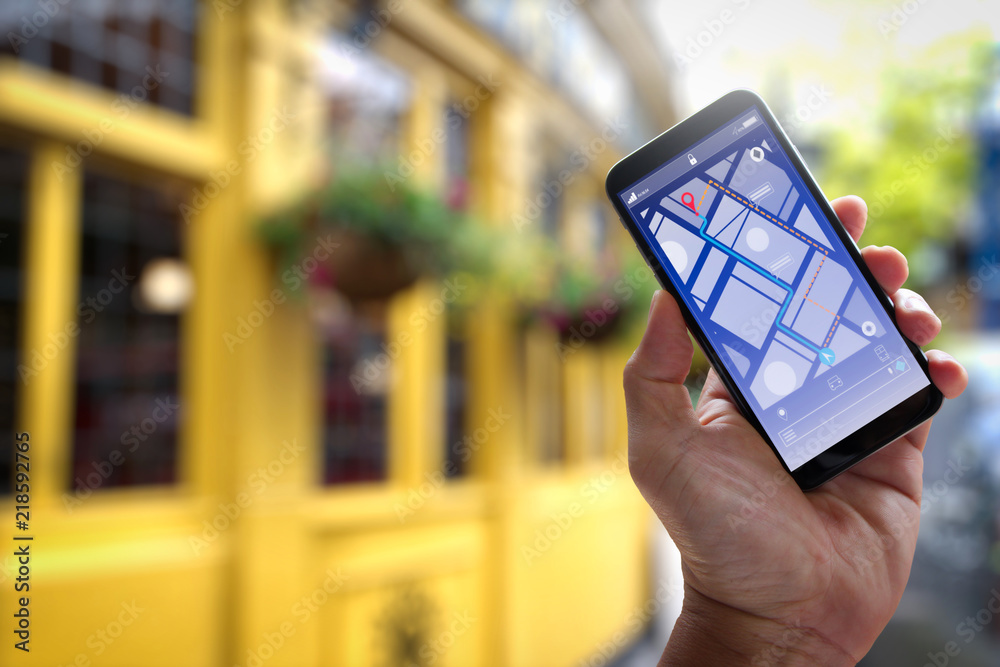 Poster Close up of Tourist using GPS map navigation on smartphone application screen for direction to destination address in the city with travel and technology concept.