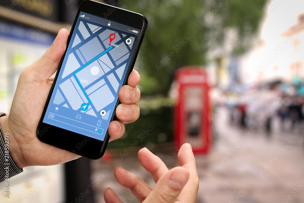Aufkleber Close up of Tourist using GPS map navigation on smartphone application screen for direction to destination address in the city with travel and technology concept.