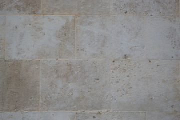 Gray wall from stone blocks close-up