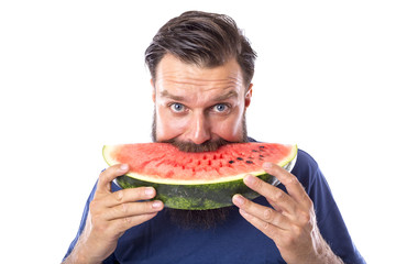 Bearded man eating watermelon