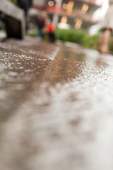 Macro water running over stone street