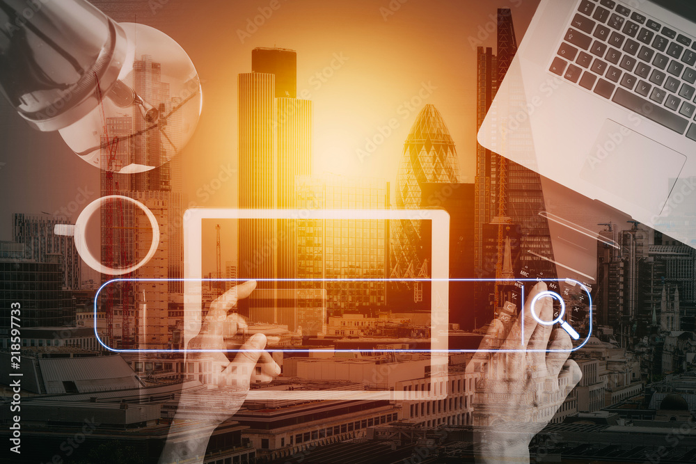 Poster Internet shopping concept.Top view of hands working with laptop and credit card and tablet computer on dark wooden table background with buildings exposure